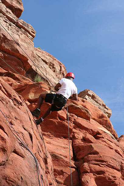 istock Male Climber descending cliff face 96695260