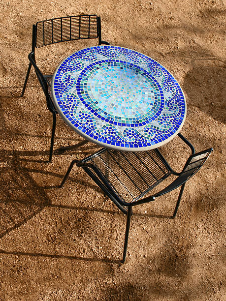 Blue mosaic tile cafe table for two stock photo