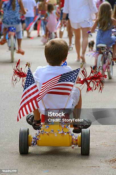 Young Boy Shows Patriotism In 4th Of July Parade Stock Photo - Download Image Now - Parade, Bicycle, Patriotism