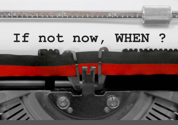 istock If not now when text by the old typewriter on white paper 966953032