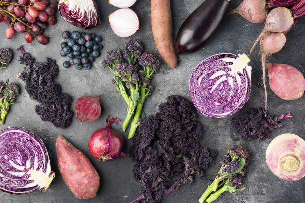 istock Vegetables background in purple, green and dark red 966953284