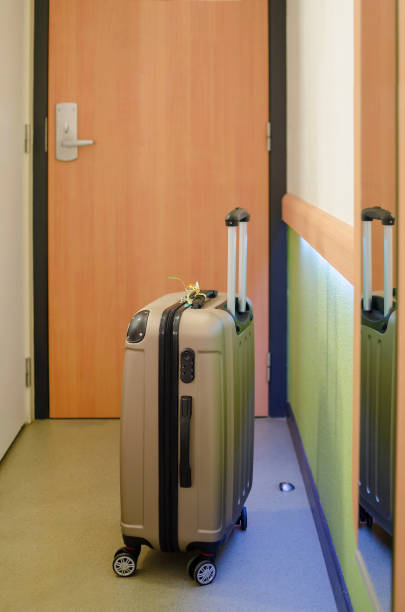 istock travel suitcase in a hotel room by arrival 966960152