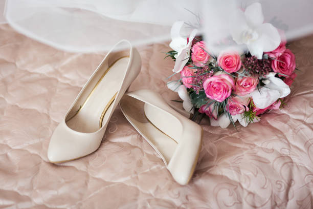 istock high heel wedding shoes and bouquet as bridal accessories 966970844