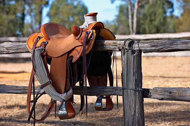 Western Horse Saddle and Fence  rail fence stock pictures, royalty-free photos & images