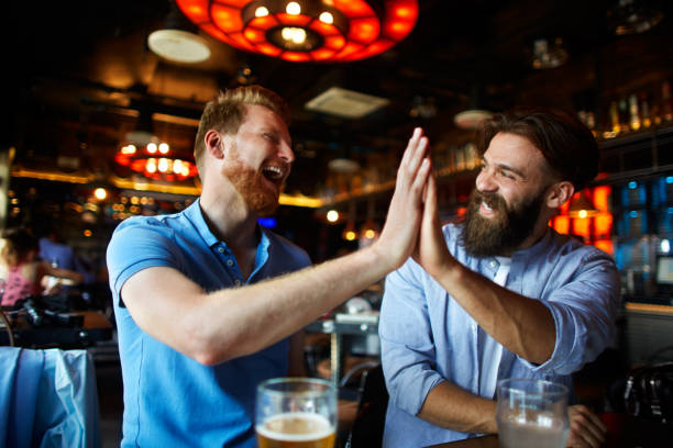 istock Male friends in the bar 966974690