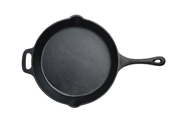 Overhead image of a cast iron fry pan on a white background with a working path.
