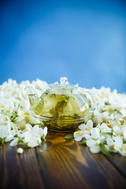 istock Tea with jasmine flowers in a glass teapot 966983734