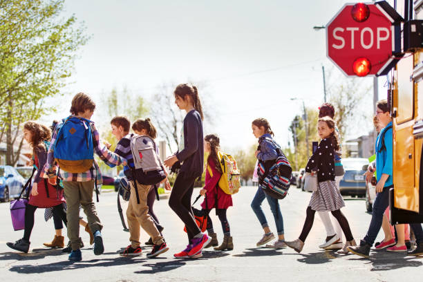 istock School kids crossing street 966983742