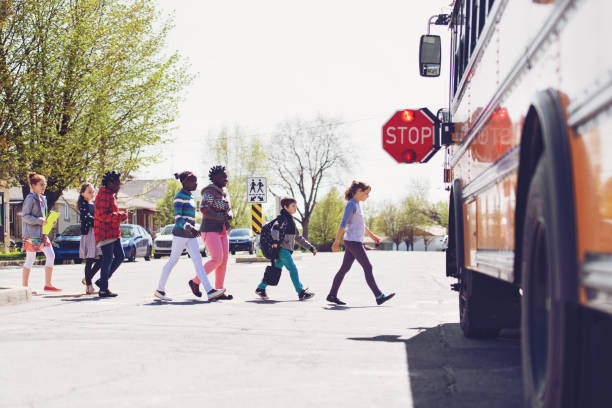 istock School kids crossing street 966985804