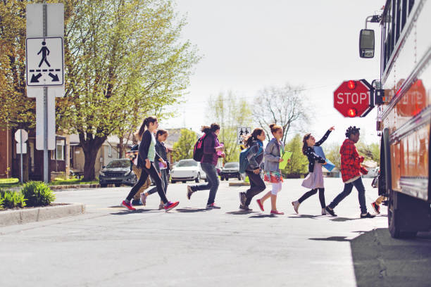 istock School kids crossing street 966985806