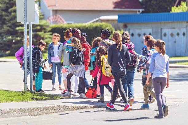 istock School kids crossing street 966985814