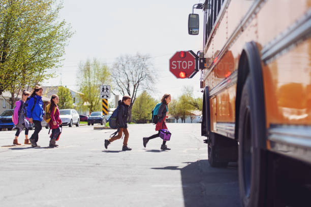 istock School kids crossing street 966985816