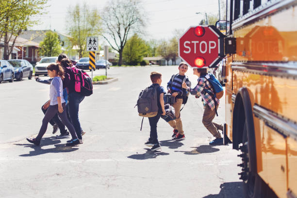 istock School kids crossing street 966985842