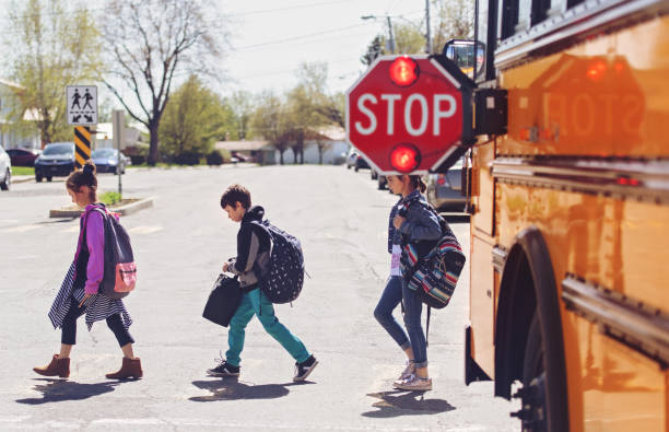 istock School kids crossing street 966985856