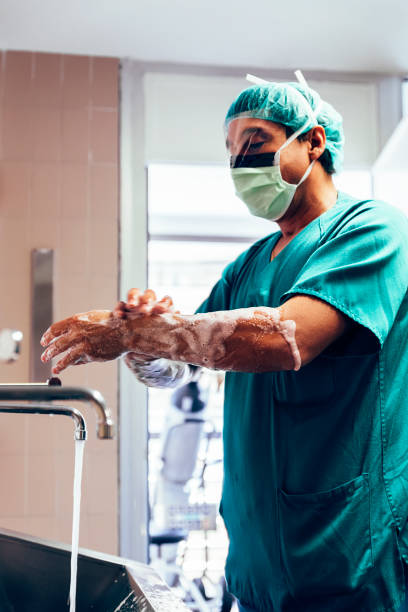 istock Doctor Washing Hands Before Operating. Hospital Concept. 966987134