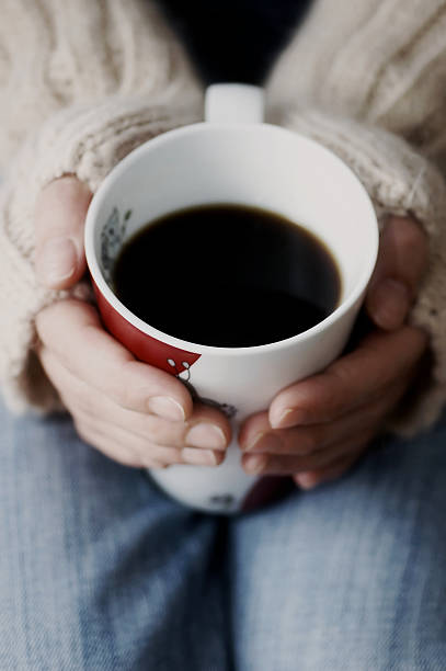 istock Female hands hold a coffee cup closeup 96699791