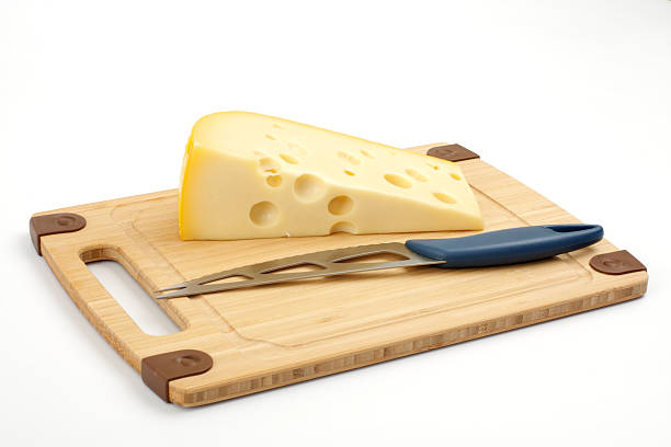 istock Cheese and knife on a wooden board 96699811