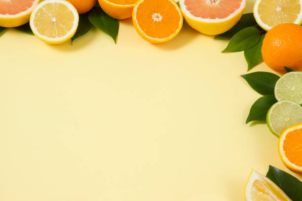 istock Citrus Fruits on Yellow Background 967006478
