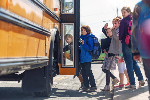 istock School kids entering in the school bus 967006986