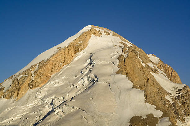 istock High rocky mountain peak with glacier 96701287