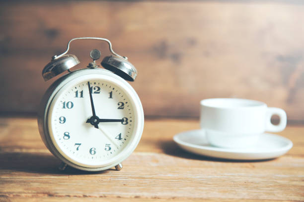 istock Alarm clock and a cup of coffee 967025556