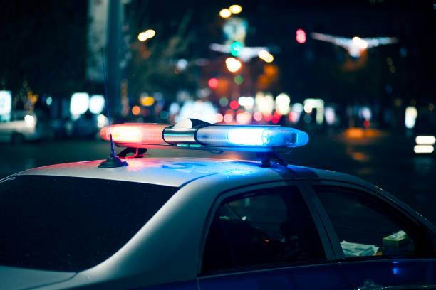 istock Blue light flasher atop of a police car 967025652