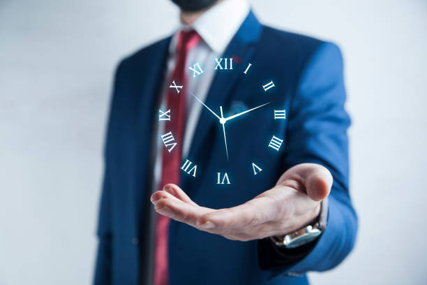 istock Businessman hand pushing time icon on virtual screen 967025750