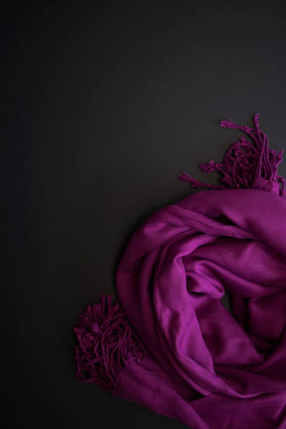 istock Purple shawl on the black background. 967026200