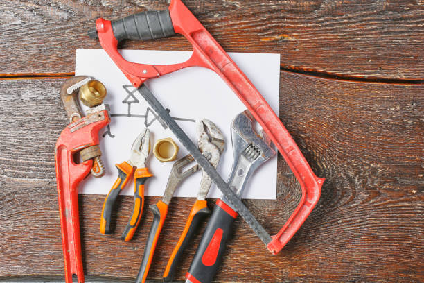 istock Workshop bench. Variety of hand tools on a wooden table, top view, copy space 967027188