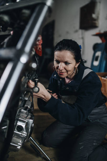 istock Man worker in motorcycle repair shop 967029716