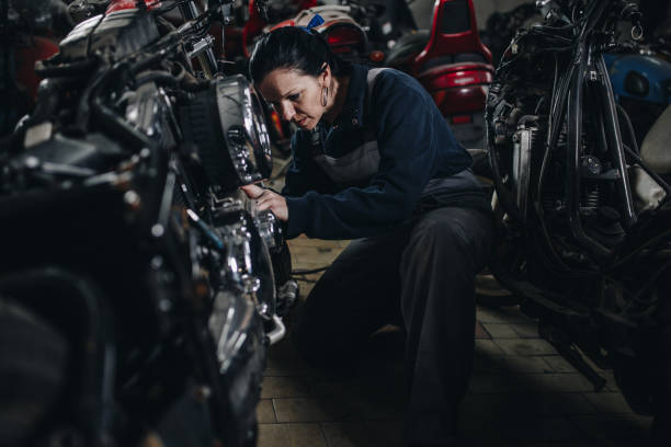 istock Man worker in motorcycle repair shop 967030212
