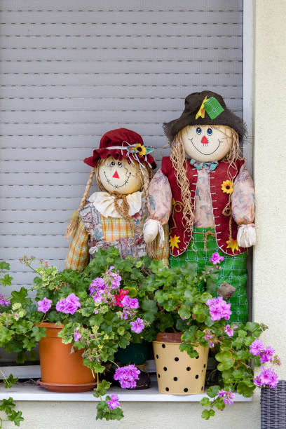 istock Two decorative dolls and flowerpots in the yard. Hungary 967031162