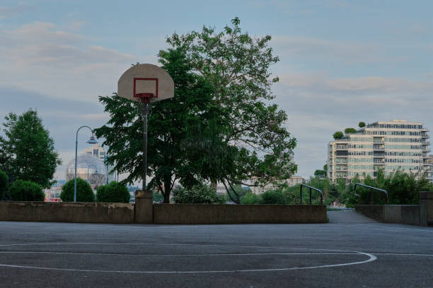 Basketball court in urban area Basketball court in urban area. Vancouver BC. Shield and ring asphalt basketball court stock pictures, royalty-free photos & images