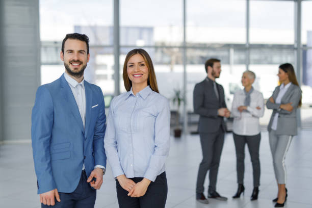 istock Portrait of two young business people at work 967035258