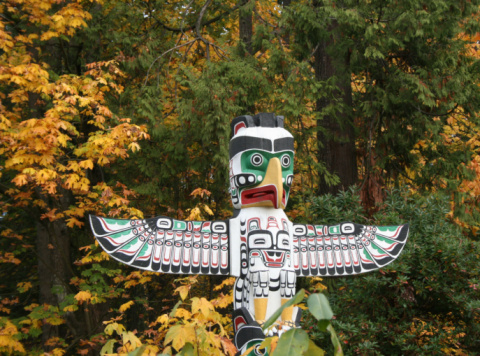 Vancouver as seen from viepoint  on the road to Cypress bowl. First nation totem pole in the front