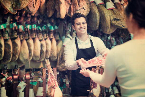 istock Female customer buying Spanish jamon 967040454
