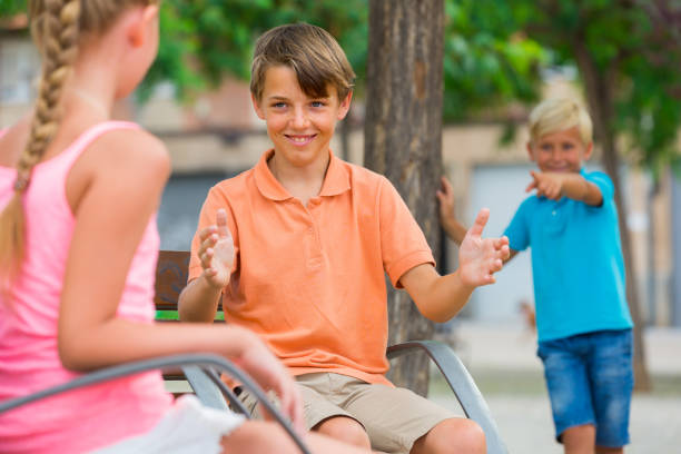 istock Boy is talking with girl 967046062
