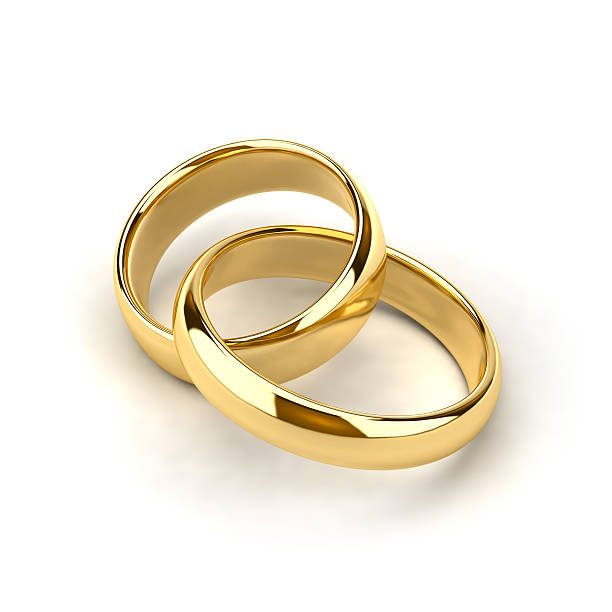 istock A pair of gold wedding rings entwined 96705909