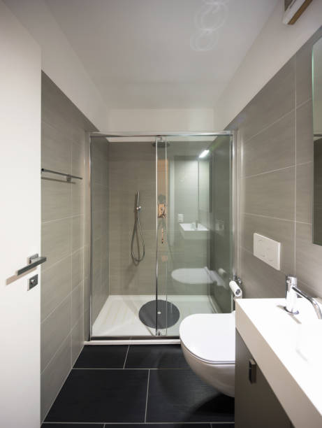 istock Modern bathroom with large brown tiles and large mirror 967061992