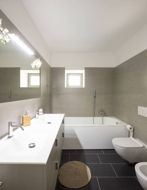 istock Modern bathroom with large brown tiles and large mirror 967062038