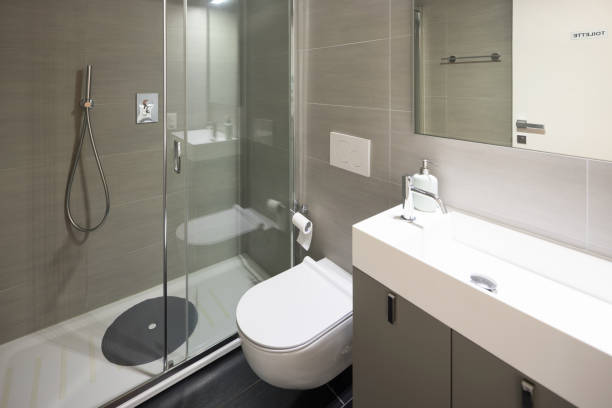 istock Modern bathroom with large brown tiles and large mirror 967062068