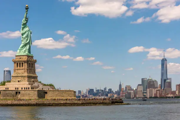 The Statue of Liberty guards New York Harbor and its magnificent skyline.