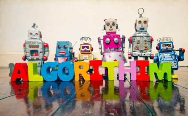 istock the word ALGORITHIM  with wooden letters and retro toy robots 967073788
