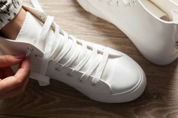 istock Woman tying shoelaces 967074414