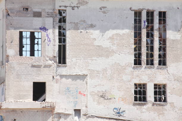 istock Old white factory building ready for demolition 967085926