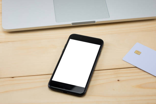 istock Office desk table with blank screen smart phone 967094134