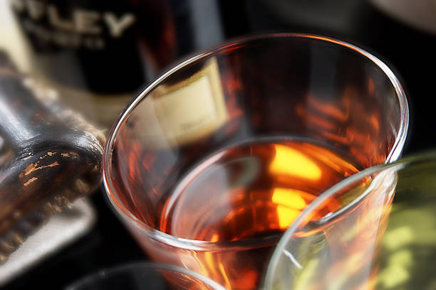Glass with whiskey. Warm atmosphere.