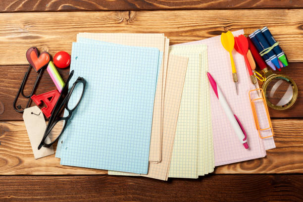 istock School office supplies on wooden background 967094558