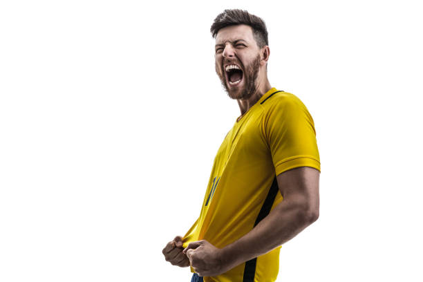 brazilian male athlete / fan celebrating on white background - fan sport football male imagens e fotografias de stock