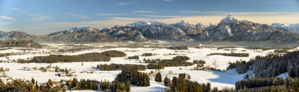 istock panoramic scene with lake Forggensee and mountains in Bavaria at winter 967096088